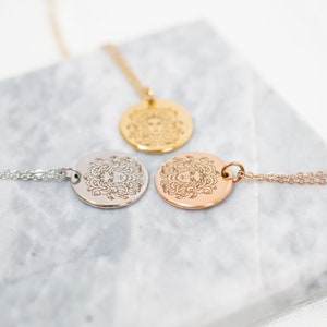 Silver gold and rose gold Medusa necklaces side by side