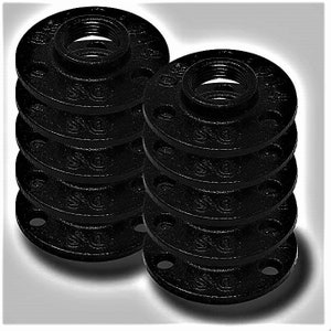 May include: A stack of ten black iron pipe flanges. The flanges are round with a threaded hole in the centre. They are commonly used in plumbing and industrial applications.