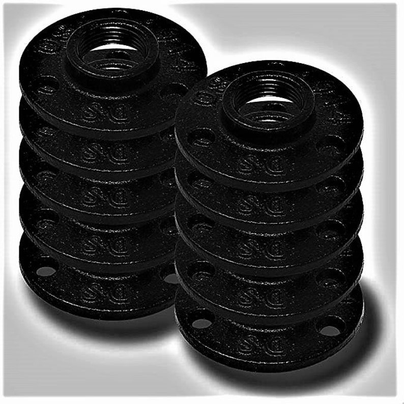May include: A stack of ten black iron pipe flanges. The flanges are round with a threaded hole in the centre. They are commonly used in plumbing and industrial applications.