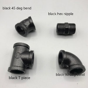 May include: Four black metal pipe fittings: a 45-degree elbow, a 90-degree elbow, a T-shaped connector, and a hex nipple.