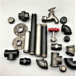 May include: Assortment of black iron pipe fittings, including elbows, tees, and flanges.  Also included are two black metal pipes, a silver metal pipe, a black metal faucet, and a red valve.