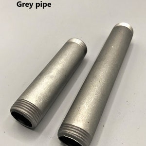 May include: Two grey metal pipes with threaded ends. The pipes are different lengths.