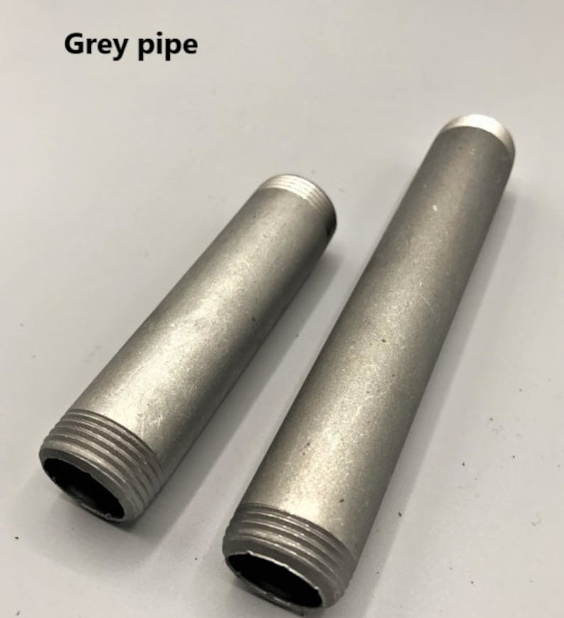 May include: Two grey metal pipes with threaded ends. The pipes are different lengths.