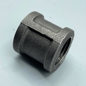 May include: A black metal pipe fitting with threaded ends.