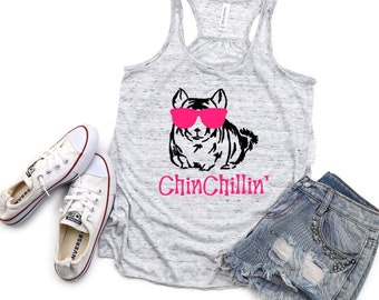 May include: A gray tank top with a black and white illustration of a chinchilla wearing pink sunglasses. The text "Chin Chillin'" is printed in pink below the illustration.