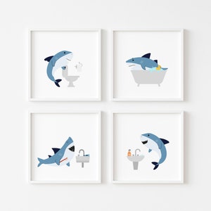 May include: Four framed illustrations of a blue shark in a bathroom setting. The shark is shown brushing its teeth, taking a bath, using the toilet, and washing its face.