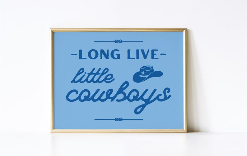 May include: A blue and gold framed print with the text "Long Live Little Cowboys" in blue script. A blue cowboy hat with a star is above the word "cowboys".