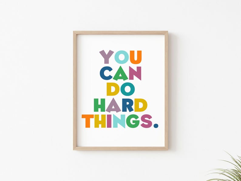 May include: A framed print with the text "YOU CAN DO HARD THINGS." in colorful letters on a white background.
