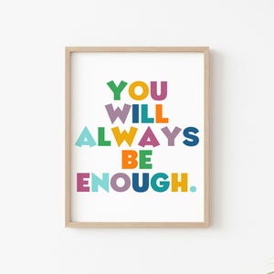 May include: A framed print with the text "YOU WILL ALWAYS BE ENOUGH." in colorful block letters on a white background.