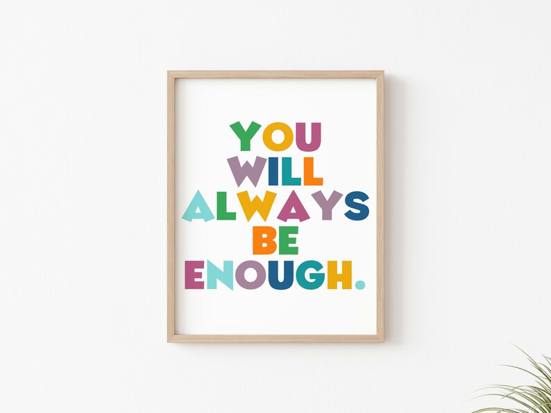 May include: A framed print with the text "YOU WILL ALWAYS BE ENOUGH." in colorful block letters on a white background.