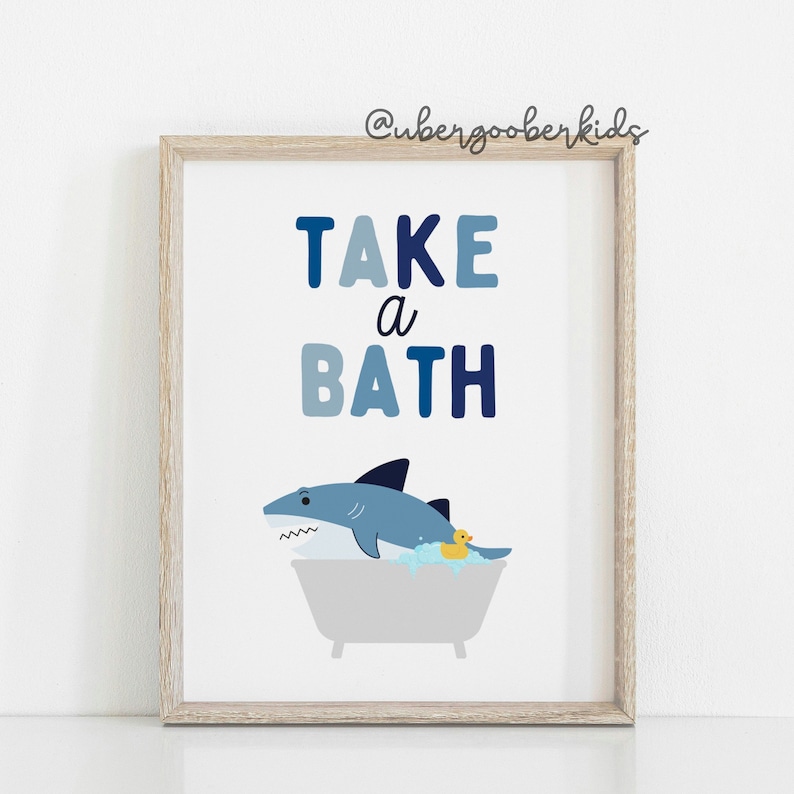 May include: A blue and white illustrated print with the text "TAKE a BATH" and a cartoon shark in a bathtub with a rubber ducky.