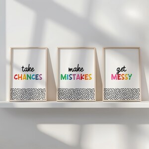 May include: Three framed prints with a white background and black polka dots. The text on the prints reads "take chances", "make mistakes", and "get messy". The text is in rainbow colors.