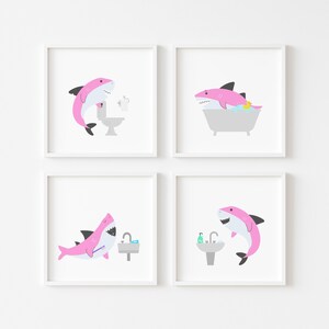 May include: Set of four pink shark bathroom illustrations. Each illustration features a pink shark in a different bathroom setting: brushing teeth, taking a bath, using the toilet, and washing hands.