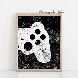 May include: Black and white printable art print of a video game controller with a distressed, textured background. The text "@ubergooberkids" is in the top right corner of the image.