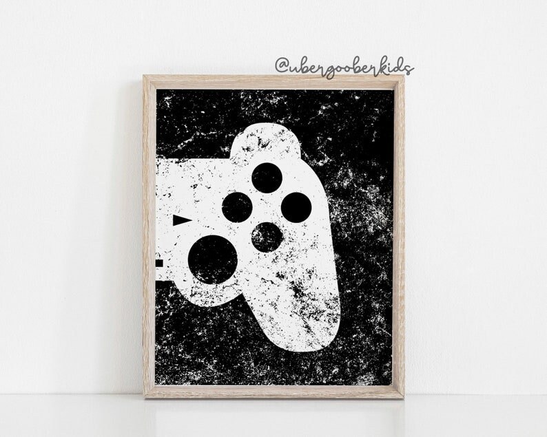 May include: Black and white printable art print of a video game controller with a distressed, textured background. The text "@ubergooberkids" is in the top right corner of the image.