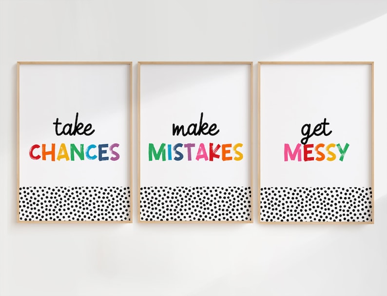 May include: Three framed prints with a white background and a black and white polka dot pattern at the bottom. The text on the prints reads "take chances", "make mistakes", and "get messy" in rainbow colors.