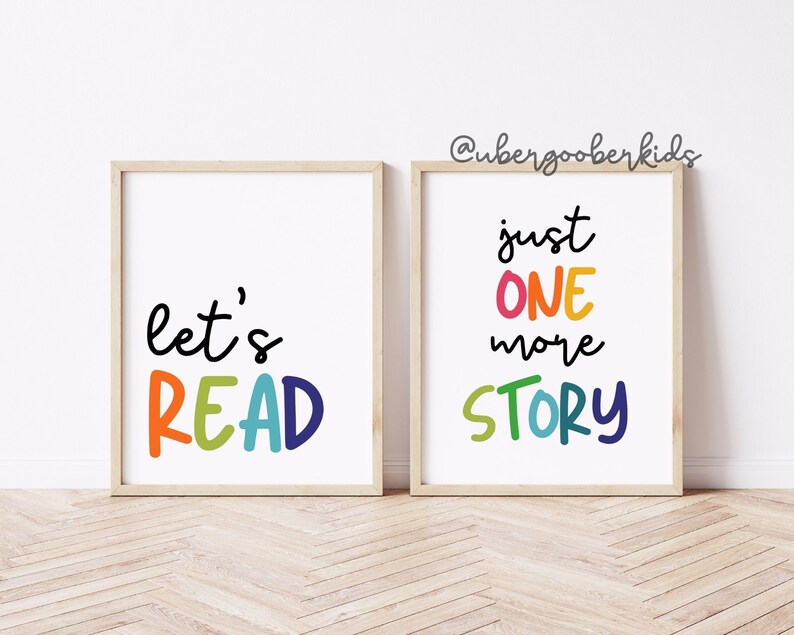 May include: Two framed prints with colorful text. The first print says "let's READ" in rainbow colors. The second print says "just ONE more STORY" in rainbow colors.