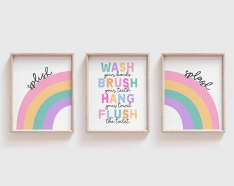 May include: Three framed prints with rainbow designs and text. The middle print says "WASH your hands BRUSH your teeth HANG your towel FLUSH the toilet". The left print says "splish" and the right print says "splash".