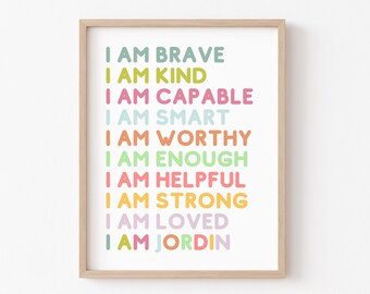 May include: A framed print with a white background and colorful text that reads "I am brave, I am kind, I am capable, I am smart, I am worthy, I am enough, I am helpful, I am strong, I am loved, I am Jordin".