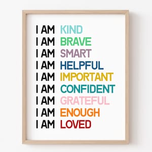 May include: A framed print with the text "I AM" followed by a list of positive affirmations in different colors: KIND, BRAVE, SMART, HELPFUL, IMPORTANT, CONFIDENT, GRATEFUL, ENOUGH, LOVED.