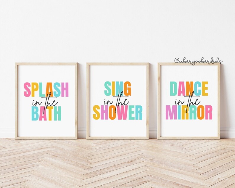 May include: Three framed prints with colorful text. The first print says "SPLASH in the BATH", the second print says "SING in the SHOWER", and the third print says "DANCE in the MIRROR".