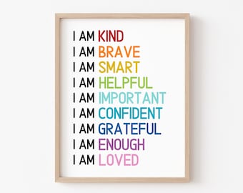Könnte beinhalten: Ein gerahmter Druck mit dem Text "I AM" gefolgt von einer Liste positiver Affirmationen in verschiedenen Farben: KIND (rot), BRAVE (orange), SMART (gelb), HELPFUL (grün), IMPORTANT (hellblau), CONFIDENT (blau), GRATEFUL (dunkelblau), ENOUGH (lila) und LOVED (rosa).