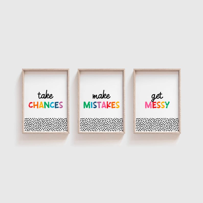 May include: Three framed prints with a black and white polka dot background. The text on the prints reads "take chances", "make mistakes", and "get messy". The text is in a rainbow of colors.