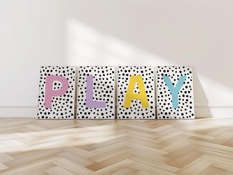 May include: Four black and white polka dot prints with the word "PLAY" in large, colourful letters. The letters are pink, purple, yellow, and blue.
