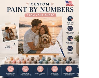 May include: A paint-by-numbers kit with the text "CUSTOM PAINT BY NUMBERS FROM YOUR PHOTO." The image shows a couple with a dog, a photo, paint pots, and a paintbrush. The kit includes everything needed for a fun and rewarding experience.
