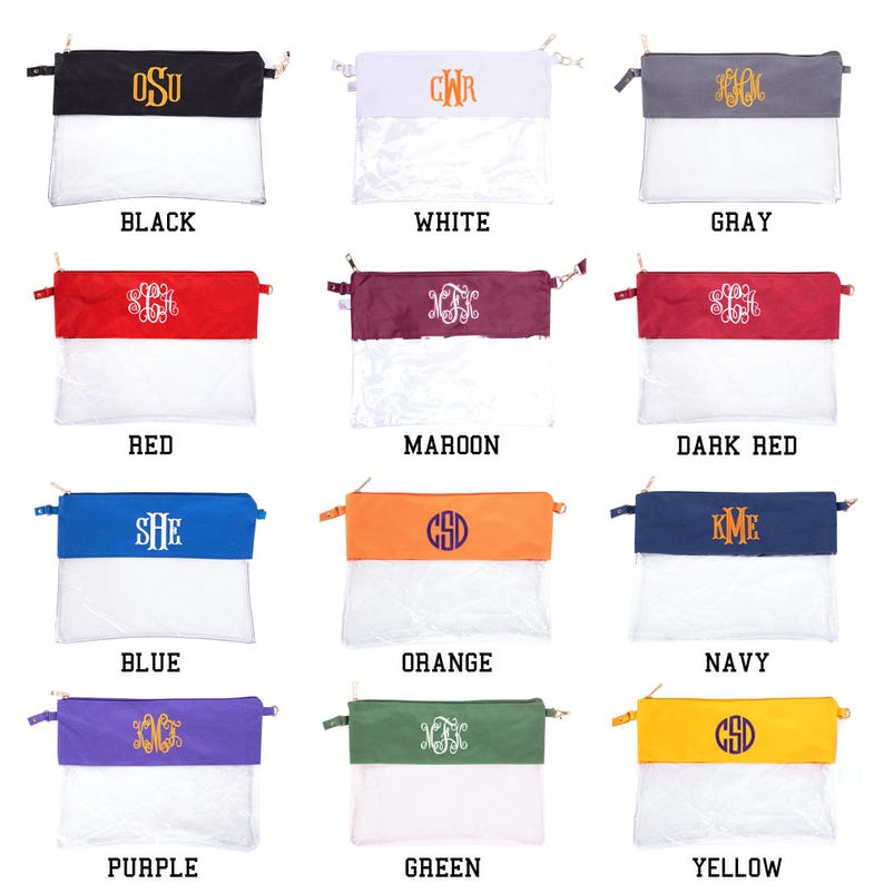 May include: Twelve clear zippered pouches with different colored fabric tops. The fabric tops are monogrammed with different letters. The colors of the fabric tops are black, white, gray, red, maroon, dark red, blue, orange, navy, purple, green, and yellow.
