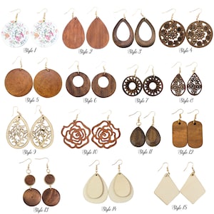 May include: Fifteen pairs of wooden earrings in various styles. The earrings are made of natural wood and feature different shapes, designs, and colors. Some earrings are plain, while others have intricate carvings or patterns. The earrings are all on a white background.