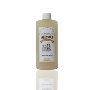 May include: A bottle of lemon oil beeswax furniture polish. The label features the text "Lemon Oil Beeswax Furniture Polish" with an illustration of a person working on a piece of furniture. The bottle contains 4 fl oz.