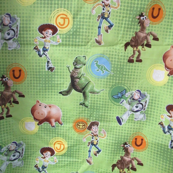 Disney Pixar Film Toy Story Dots Allover Springs Cotton Fabric out of print from2010 green multi color that is 1/2 yard by 43 inches wide.