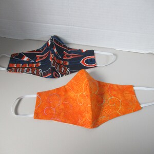 3 Handmade Olson woman  Chicago Bearsand orange  washable masks  out of   cotton and machine washable  in navy orange  and orange   multi.