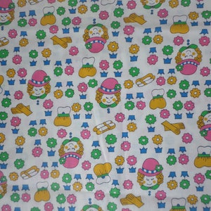 Girls fabric Girls head wearing hats shoes glooves purses and lots of flowers pastel colors 1 yard by 44 inches wide.