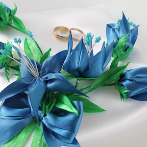 Handmade Ring Pillow: A touch of elegance in satin with lilies in blue