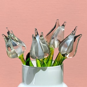 Beautiful white-clear-opal color glass tulip.  Excellent addition to your collection. Each flower is priced individually.