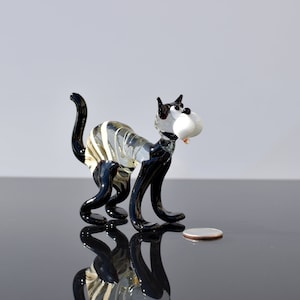 Clear-white-black glass cat, Detailed figurine with a lot of personality. Excellent addition to your glass menagerie collection.