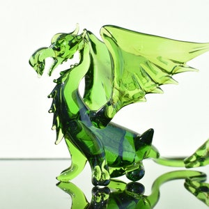 Gorgeous Glass Green Dragon with wings. Detailed figurine with a lot of personality. Excellent addition to your glass menagerie collection.
