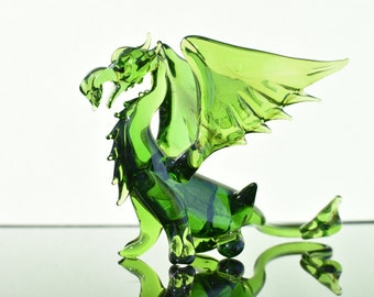 Gorgeous Glass Green Dragon with wings. Detailed figurine with a lot of personality. Excellent addition to your glass menagerie collection.