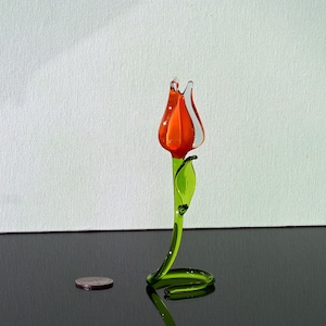 Gorgeous orange glass tulip free-standing on its stem. It is an Excellent addition to your glass collection, a unique gift.