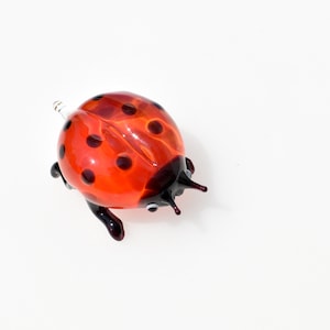 Cute Glass Ladybug. Whimsical figurine with a lot of character and personality. Excellent addition to you glass menagerie collection.