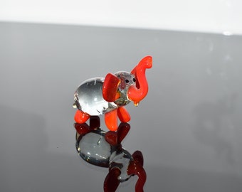 Cute Glass Elephant. Whimsical figurine with a lot of character and personality. Excellent addition to your glass collection, unique gift.