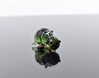 Cute green glass hippo. Whimsical figurine; lots of character and personality. Excellent addition to your glass collection, unique gift.