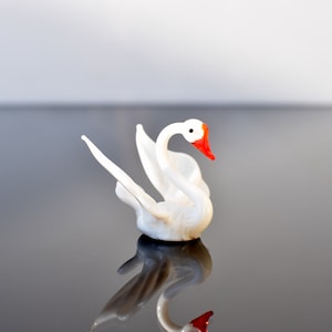 Cute glass white swan. Gorgeous  figurine with a lot of character and personality. Excellent addition to your collection, unique gift.