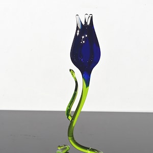 Gorgeous cobalt blue glass tulip free—standing on its stem. This is an excellent addition to your glass collection and a unique gift.