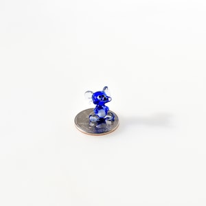 World&#39;s smallest Cute  blue Glass Mouse. Detailed figurine with a lot of personality. Excellent addition to your collection.