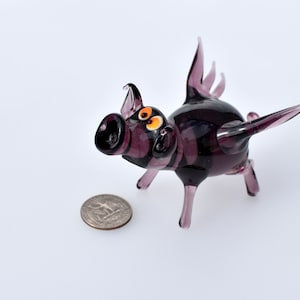 When Pig Fly.Glass purple pig, Detailed figurine with a lot of personality. Excellent addition to your glass menagerie collection.