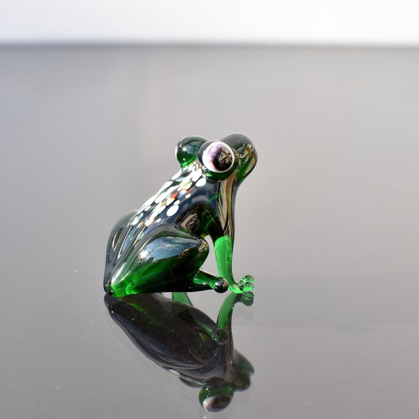 Elegant glass frog. Whimsical figurine with a lot of character and personality. Excellent addition to your glass collection, unique gift.