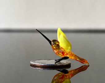 Tiny Glass colorful yellow wings humming bird. Detailed figurine with a lot of character.  Excellent addition for your figurines collection.